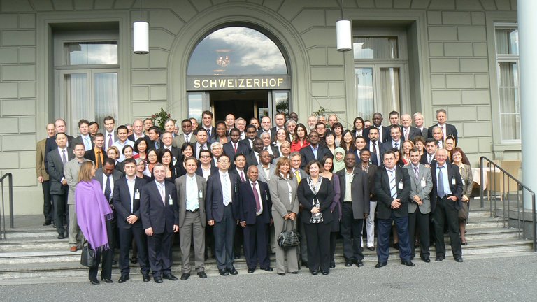 Group photo of the network meeting participants outside the conference building